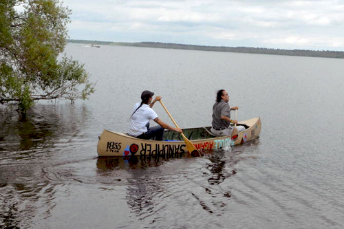 honor the earth paddles in protest against sandpiper pipeline 1.jpg